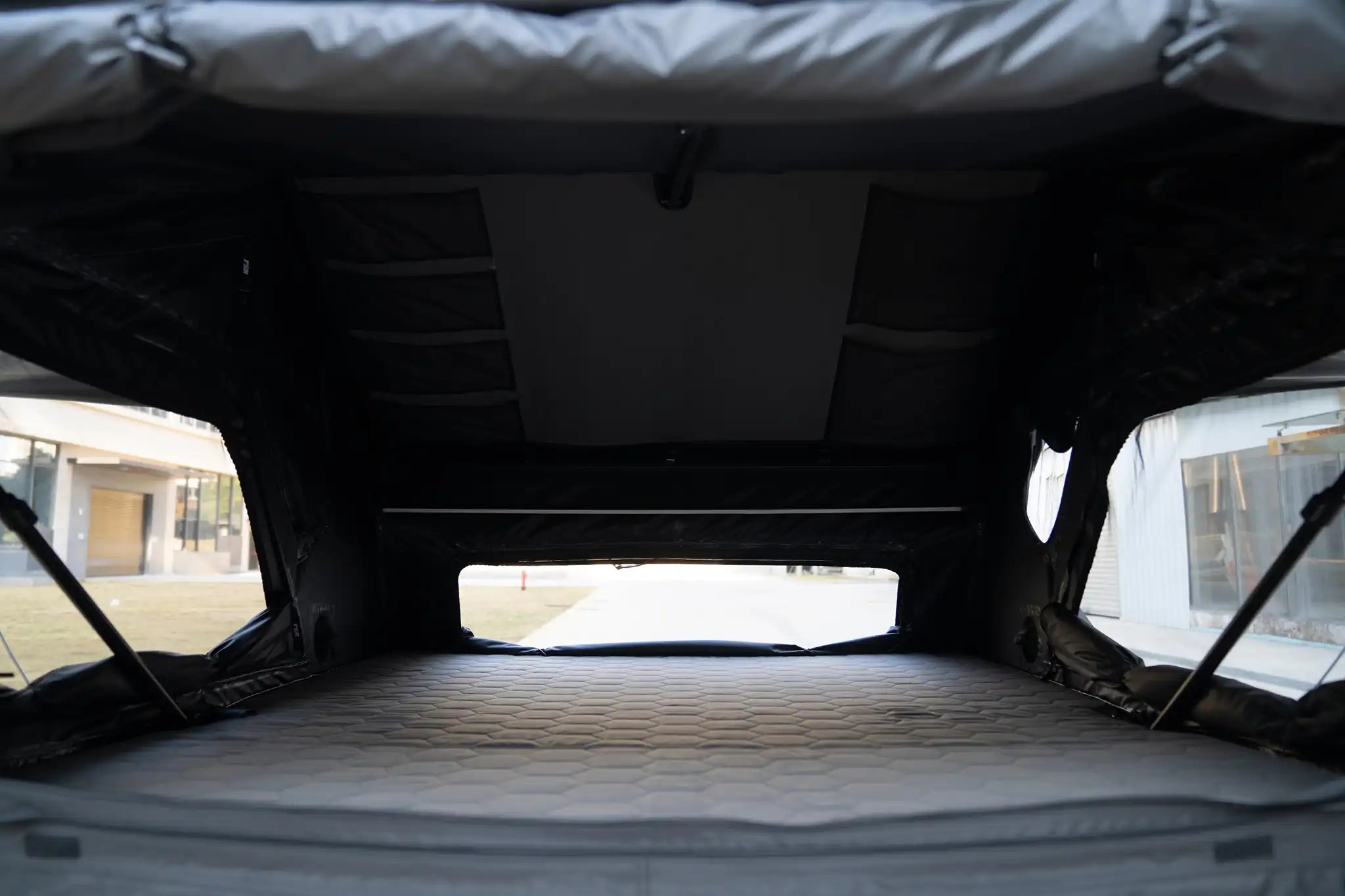 Image showing the interior of the FSR Kali King hard shell rooftop tent from Freespirit Recreation with door and windows open.