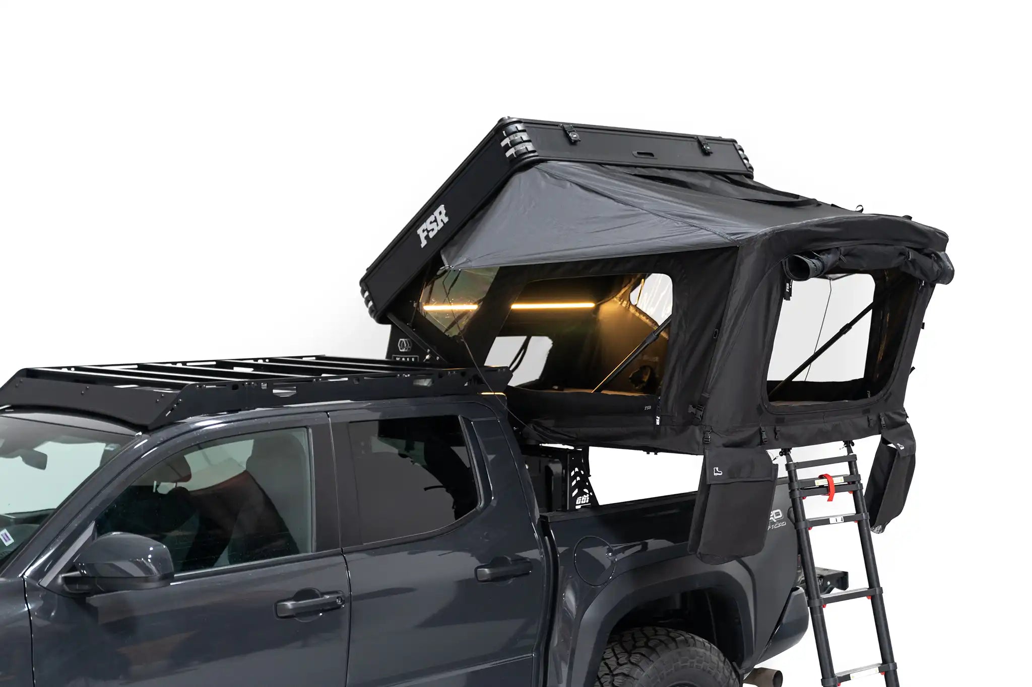 Exterior Photo of Kali hardshell rooftop tent by FSR with all windows open.