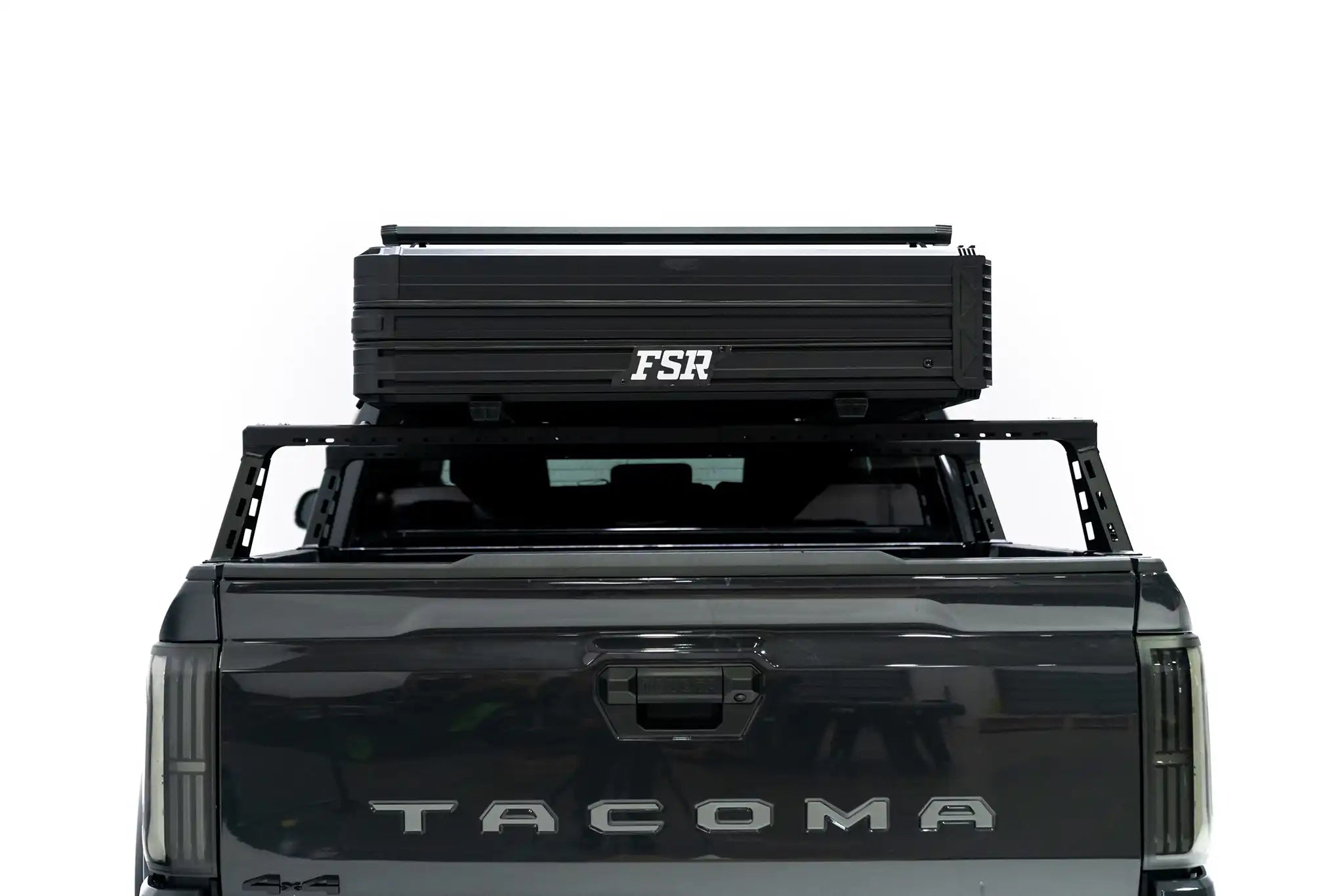 Rear facing photo of FSR Nova rooftop tent closed, mounted on a 2025 Toyota Tacoma bed rack.