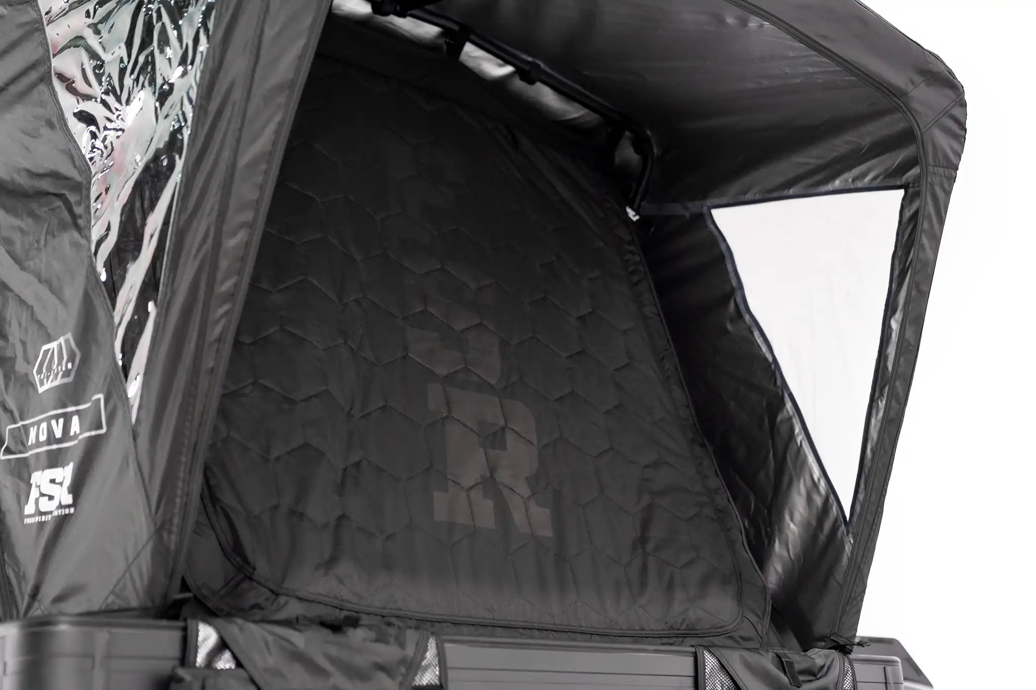 Up close photo of the FSR Nova rooftop tent deployed with front door closed.