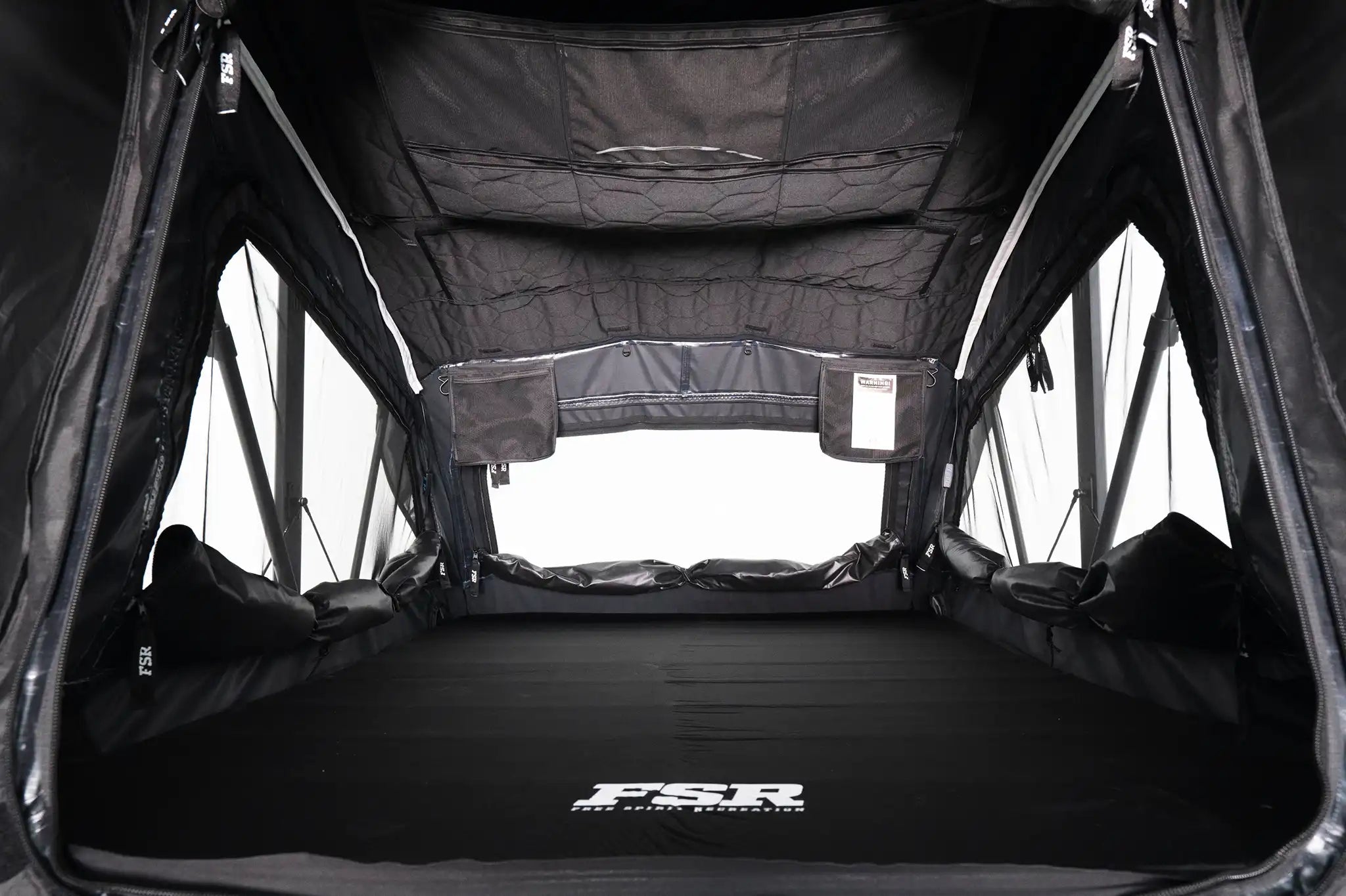 Interior photo of FSR Nova rooftop tent deployed with the interior lights off.