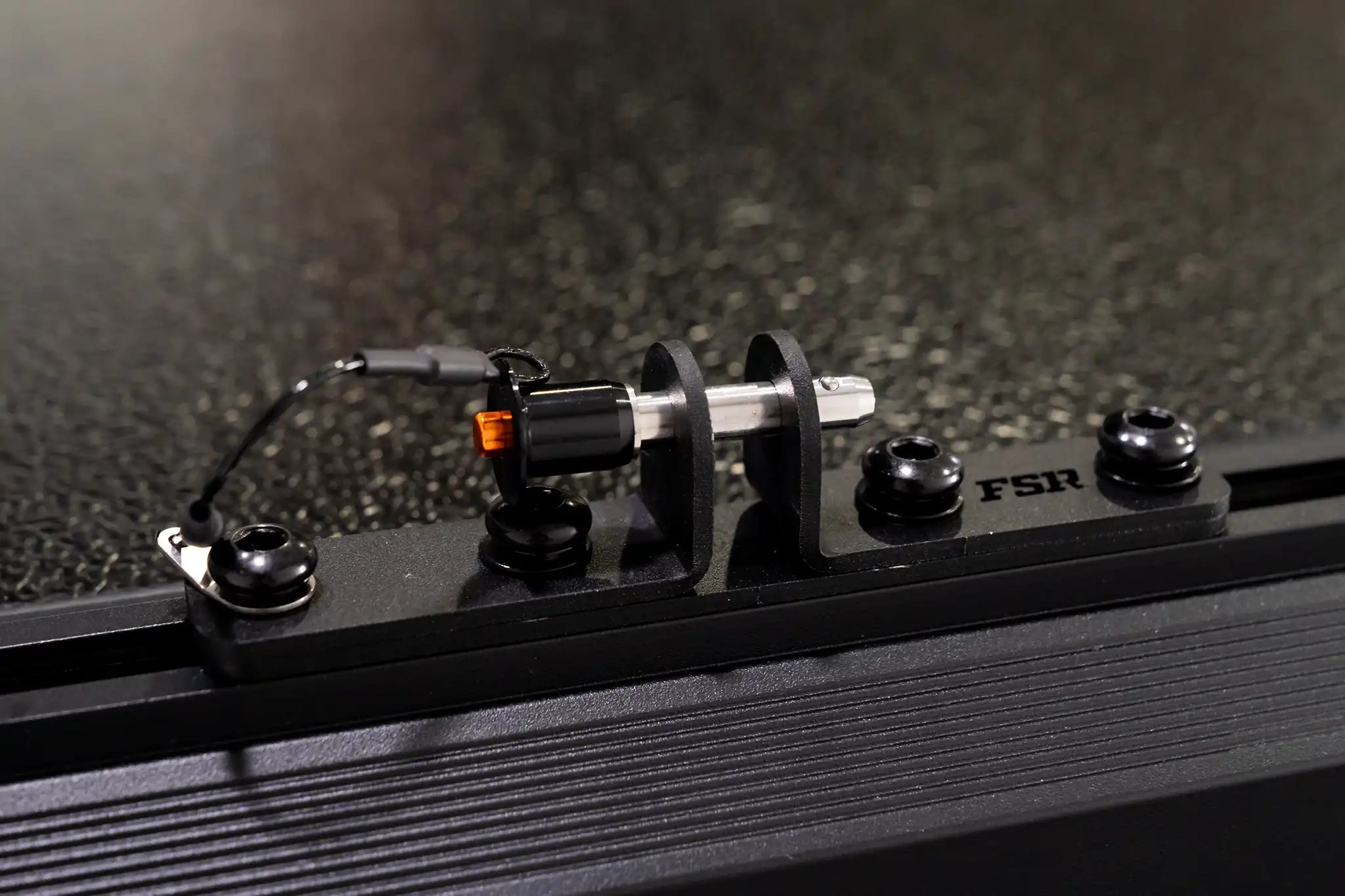 Close-up photo of the ladder pins installed on the Nova rooftop tent with FSR branding visible. 