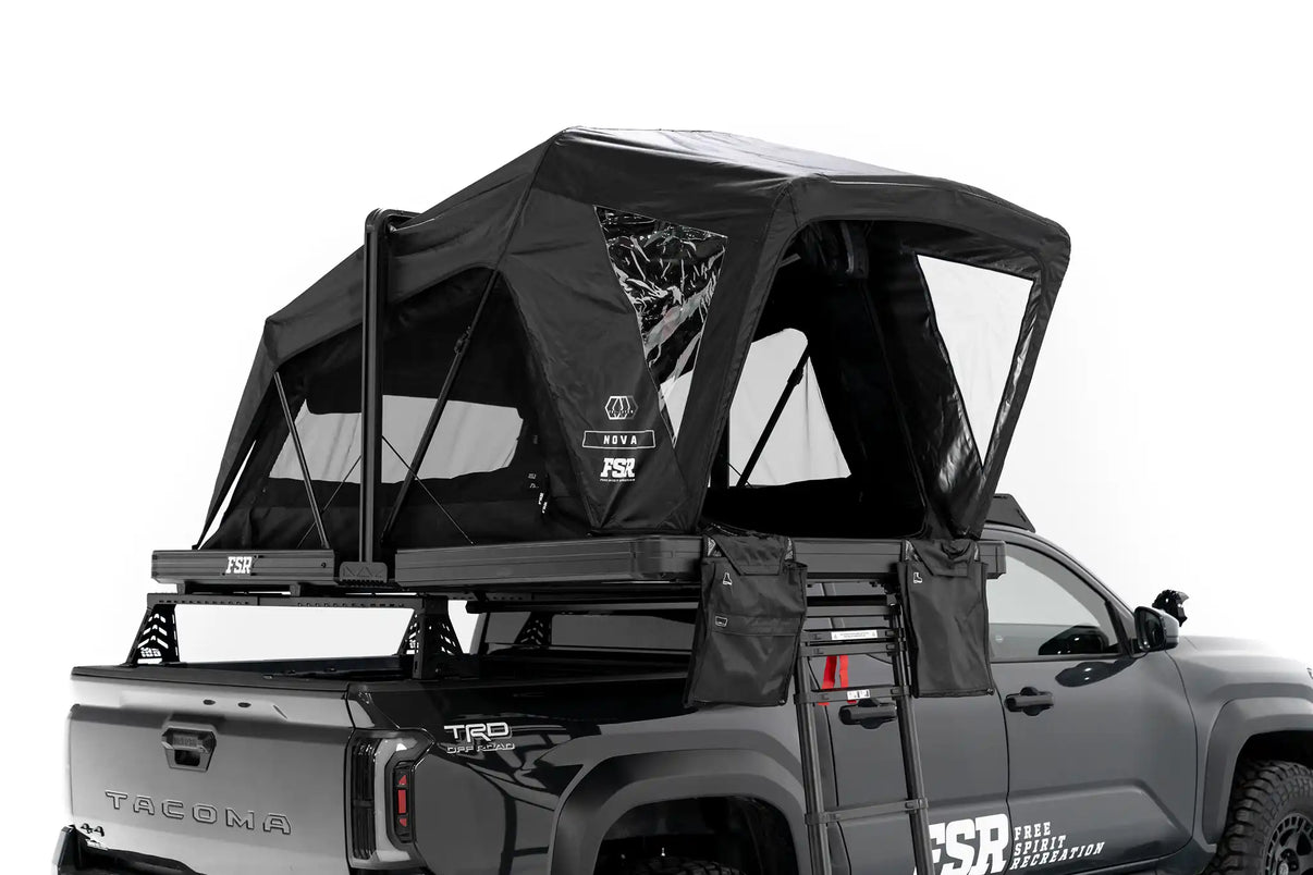 Photo of FSR Nova Standard Tri-Layer rooftop tent deployed on the rear of a black 2025 Toyota Tacoma.