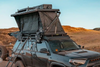 FSR roof top tent mounted on the roof rack of an overland Toyota 4Runner setup in a desert landscape