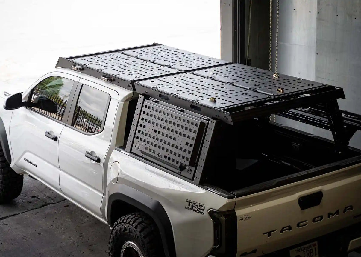 Backwoods Adventure Mods Bed Rack DRIFTR Topper cargo carrier add-on installed on a 3rd Gen Toyota Tacoma Overland truck bed rack with optional storage accessories | Free Spirit Recreation